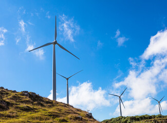 Landscape with wind turbine for power generation.
