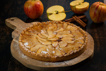 Delicious apple pie on a wooden table, from above