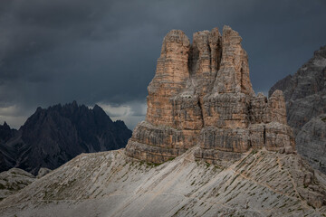 Sasso di Sesto mountains peak in the Dolomite Alps in South Tyrol with dramatic dark sky, Three Peaks Nature Reserve, Italy.