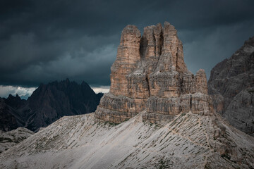 Sasso di Sesto mountains peak in the Dolomite Alps in South Tyrol with dramatic dark sky, Three Peaks Nature Reserve, Italy.