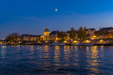 Parisian Architecture View From the Seine Docks at Blue Hour Moonrise Lights and Reflections
