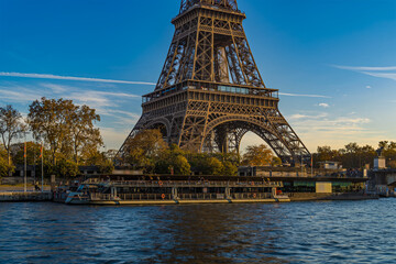 Golden Hour in Paris After a Sunny Day Eiffel Tower and Tourists Cruises on Seine River
