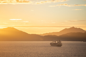 Container ships in ocean, South China Sea, Sunset