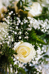Natural yellow rose bouquet in natural lightning outdoors on display with blurry blank intentional background