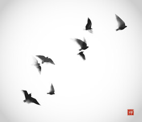 Ink painting of flying birds. Traditional oriental ink painting sumi-e, u-sin, go-hua. Translation of hieroglyph - zen. Can be used for book cover, greeting card etc