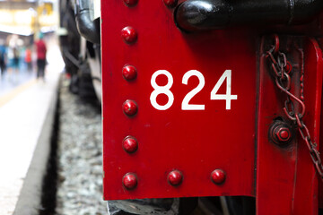 Closeup The serial number is on the large metal front of the steam locomotive
