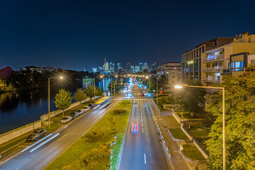 Traffic at Night Towards La Defense Business District Buildings and Seine River