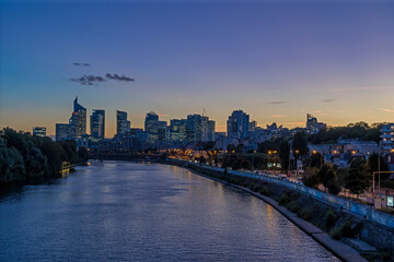 Blue Hour at Sunset at La Defense Business District With Seine River and Skyline