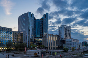 Some of the Towers and Hotel at La Defense Business District at Day With Clouds Pedestrians