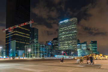 The Towers of La Defense Business District at Night Game of Light and Peoples Moving