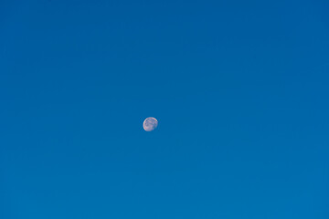 Minimalist Full Moon at Day Without Clouds Blue Sky