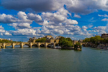 Wide View of Paris Historical Center Under Sunny and Cloudy Sky Seine River Bridges