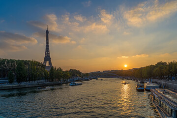 Sunset Over Eiffel Tower in Paris Seine River and Boats Cruises Trees and Clouds