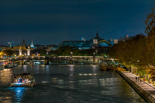 An Above View of Seine River at Paris at Night Tourists Cruises Bruidges Peoples on Docks