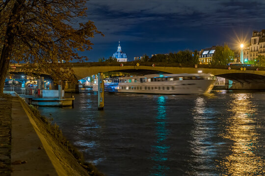 Boats Moving Over the Seine River in Paris a Night Bridges and Architecture