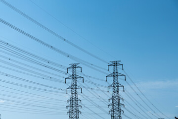 High voltage line under blue sky
