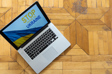stop war and patriot. laptop, flag of ukraine