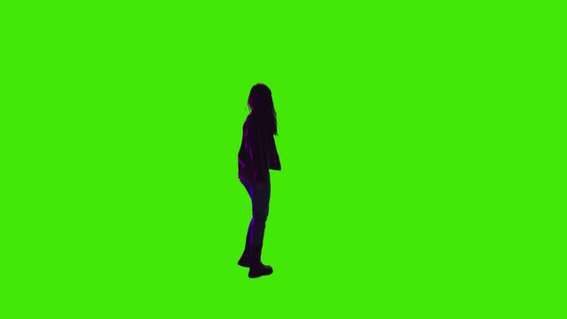 A girl with beautiful silky hair dancing and enjoying in a concert on greenscreen