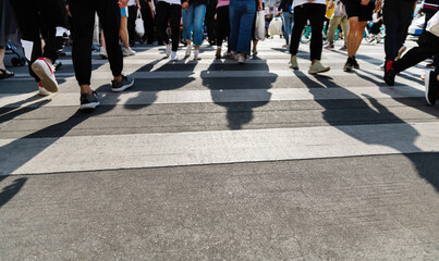 Shadows of people on the crosswalk
