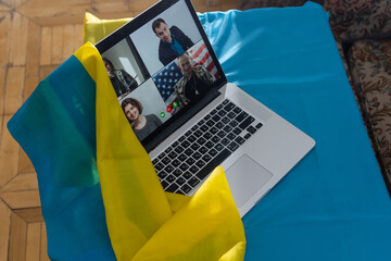 laptop with video conference near the flag of ukraine
