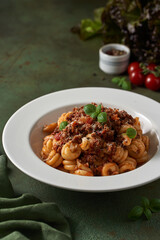 pasta bolognese on a dark green background