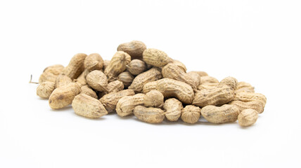 Organic peanuts in shell isolated on white background. Heap of peanut closeup