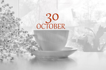 calendar date on light background with porcelain white tea pair and white gypsophila with copy space. October 30 is the thirtieth day of the month