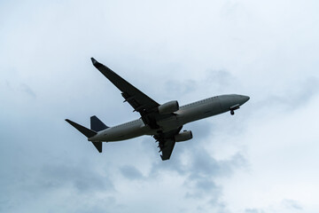 Background of airplane flying in overcast sky