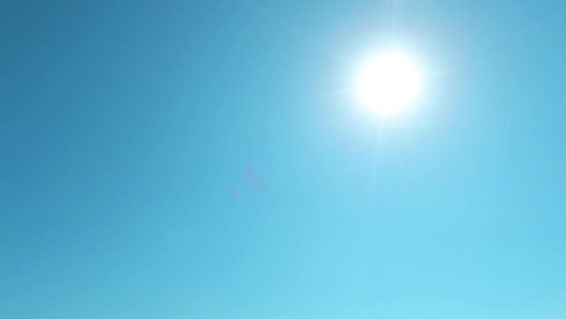Cyan blue sky background n bright sun light ray or sunbeam