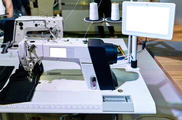 Modern sewing machine in workshop