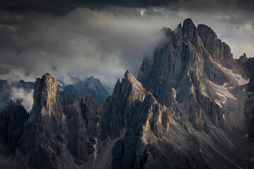 Mountain peaks in the Dolomite Alps in South Tyrol with dramatic cloudy sky, Three Peaks Nature...