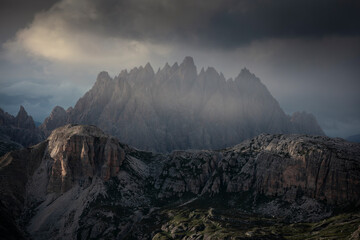 Fototapeta premium Haunold mountain chain with storm clouds during sunset at Three Peaks Hut in the Dolomite Alps in South Tyrol, Italy.