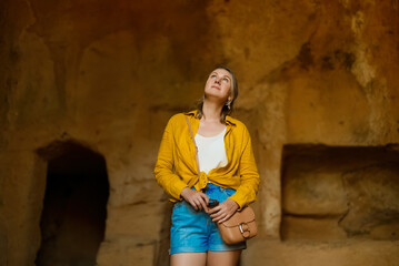 Woman visiting Tombs of the Kings in Paphos.