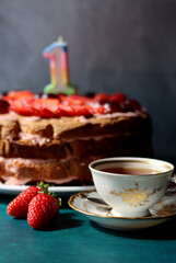 Colorful still life with Birthday cake and retro styled tableware. Strawberry cake on a table. 