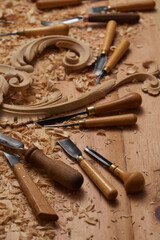 Woodworking tools. Carving wood with chisel. Carpenter's hands use chiesel. Carpenter wood carving equipment. Woodworking,