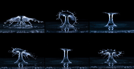 Splash and umbrella on black background. Reflection on the surface of the water.