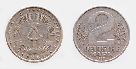 Germany East GDR - circa 1957 : a tow german marks coin of the GDR with the Hammer and Zirkle coat...