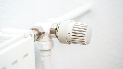 heating regulator knob thermostat on a room heating radiator