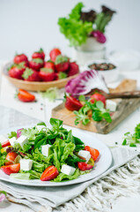Fresh salad with feta cheese and strawberry