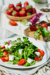 Fresh salad with feta cheese, strawberry and and salad mix. ?lose-up