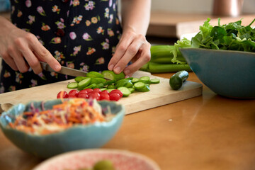 person cutting vegetables