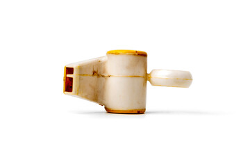 antique plastic whistle isolated on white background, retro sports equipment