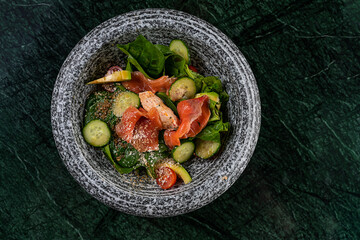 Salmon Poke Bowl with Avocado ingredients Ahi shoyu,Vinegar, sesame, onion Healthy Food Hawaii Poke don style combination Japanese food famous popular meal on wood background decorate with leek flower