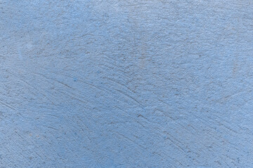 Old concrete wall worn cement background with abstract paint blue rough texture