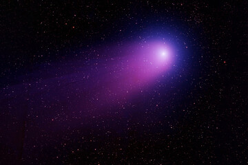 Bright comet on a dark background. Elements of this image furnished by NASA