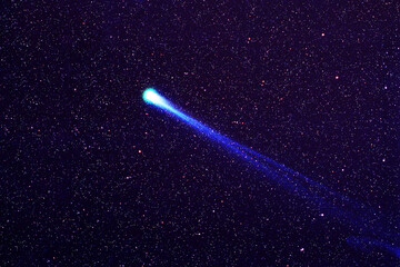 Bright comet on a dark background. Elements of this image furnished by NASA
