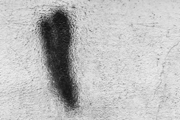 Trace of a brush of black paint on an old white concrete wall abstract pattern urban design