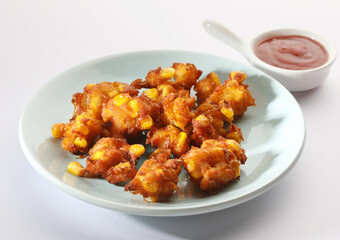 Crispy Corn pakora/pakoda, bhajji, Bhaji, bajji or pattice . served with tomato ketchup