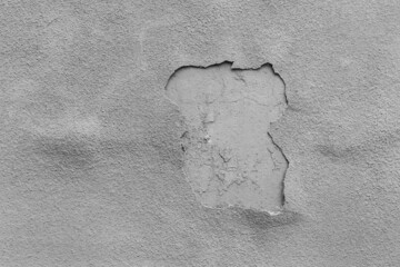 Old peeling grey plaster with weathered worn wall texture gray background
