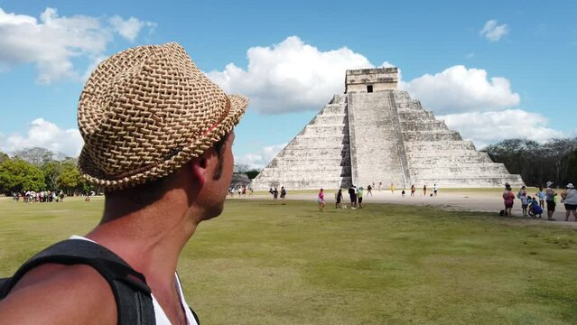Tourist man visit Chichen Itza is a large pre-Columbian city built by the Maya people which has Mesoamerican Pyramids. The archeological site is located in Tin&uacute;m Municipality, Yucat&aacute;n State, Mexico.